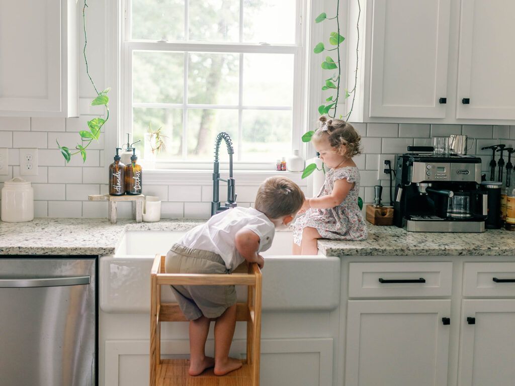 kids playing in kitchen sink