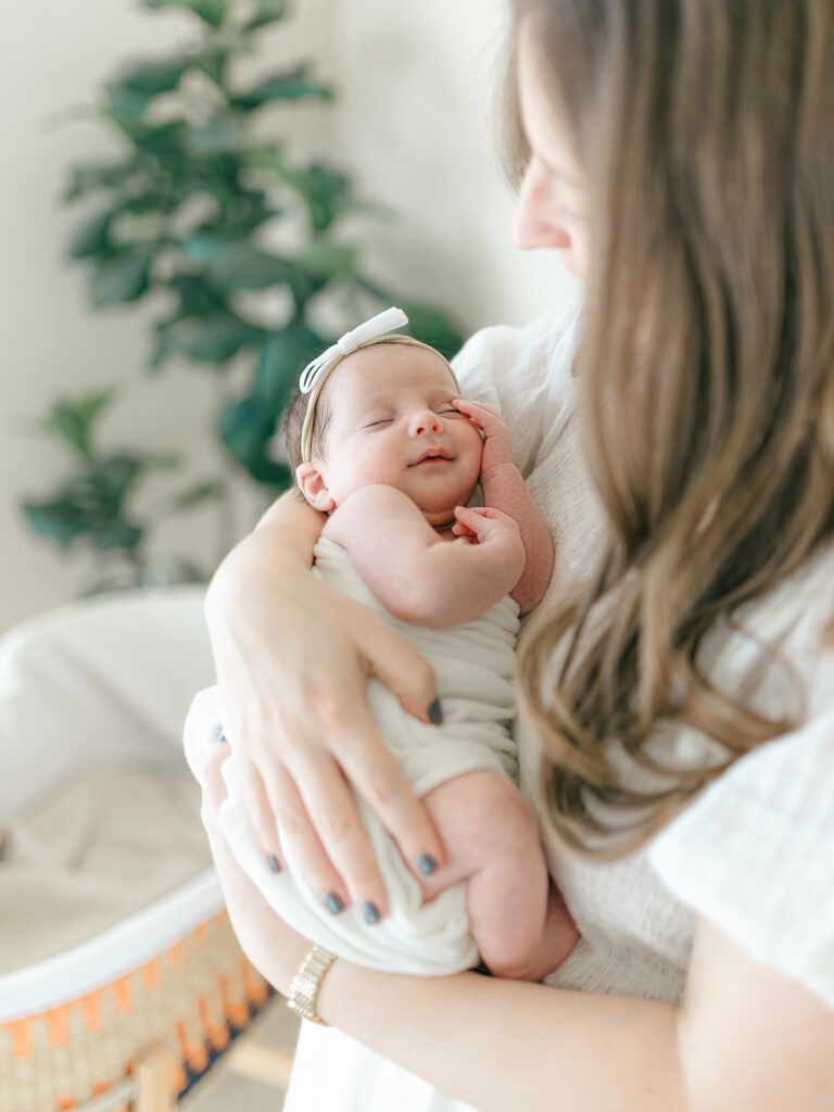 newborn baby girl held by mother in charlotte, nc